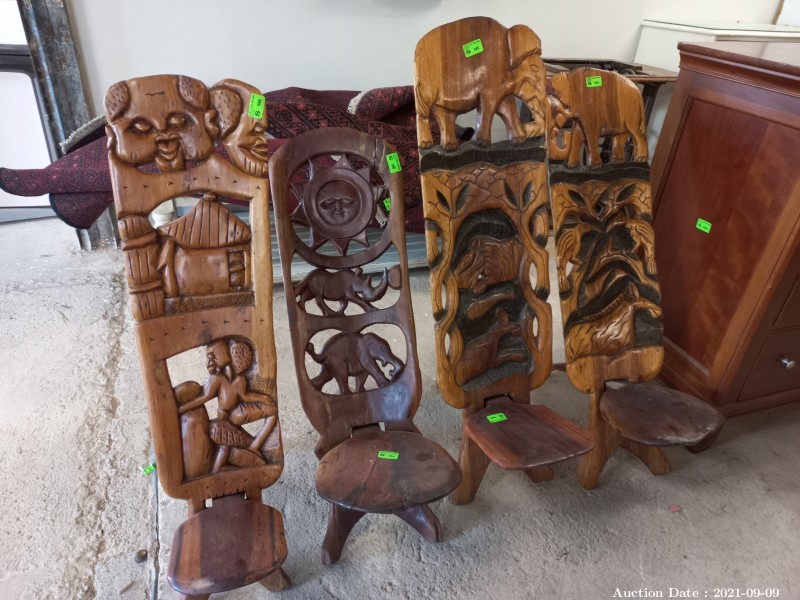 126 - Collection of four Folding African Carved Chairs