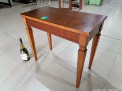 Description 238 - Attractive Wooden Table with Storage Compartment
