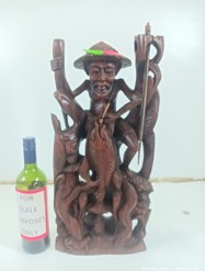 Description 4114 - Decorative Wooden Carving of a Man and a Fish with a Spear